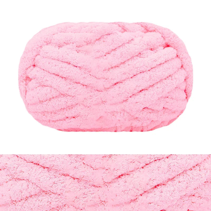 A ball of pink chunky chenille yarn with a ribbed texture.