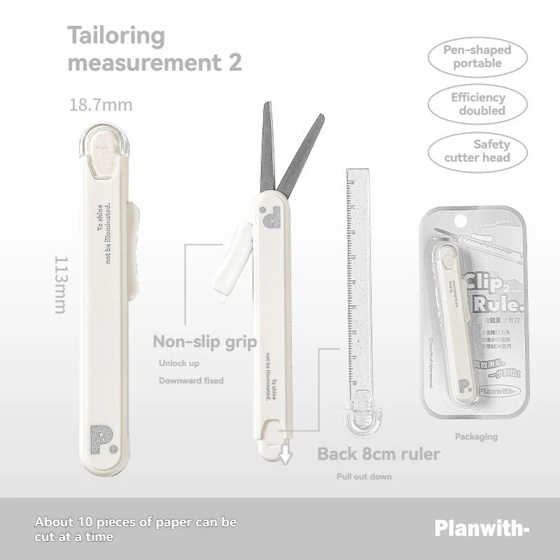 A white pen-shaped tool featuring scissors and a ruler, shown with various components and packaging.
