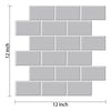 A rectangular mosaic of light gray self-adhesive tile stickers for kitchen or bathroom decoration.