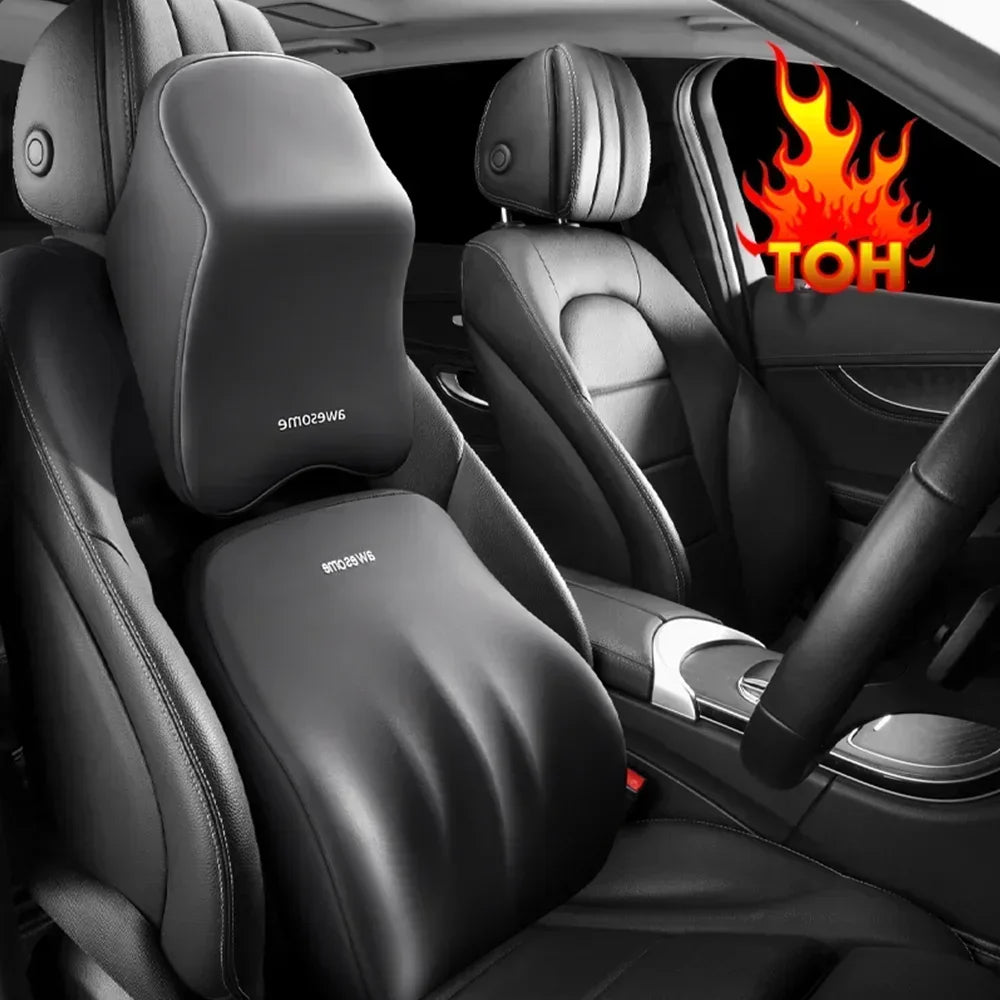 Black memory foam car headrest pillow with shoulder support installed in a car seat interior.