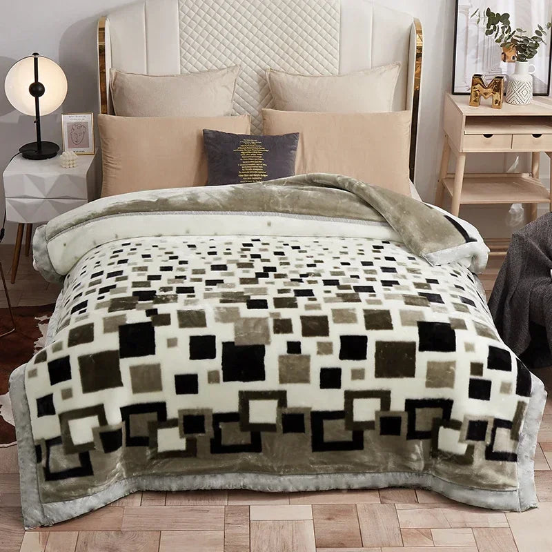 A beige weighted plush blanket is displayed on a bed with white linens and pillows.