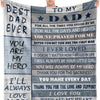 A gray fleece throw blanket with text dedicated to a father, including messages of love and gratitude.