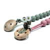 A food-grade silicone pacifier clip with an anti-lost chain featuring light pink and sage green beads.