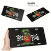Black aluminum license plate sign featuring a vintage Rat Fink design with red and green accents.