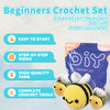 A purple bag of beginner crochet yarn and tools with a yellow crocheted bee toy.
