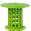 A bright green flexible hair catcher drain cover for sinks and tubs.