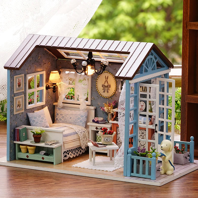 A wooden miniature dollhouse kit featuring a bedroom scene with LED lights and decorative elements.