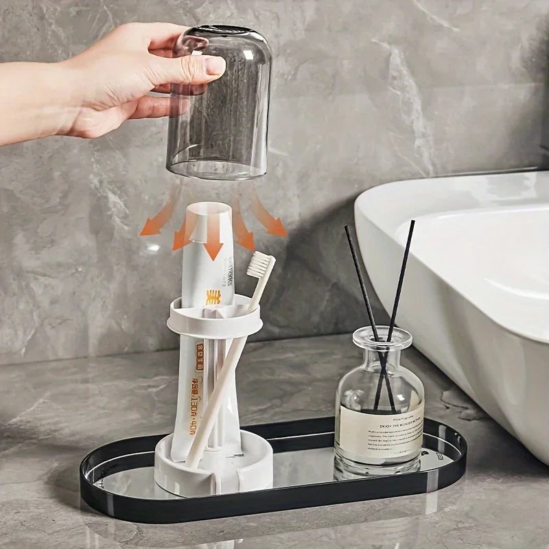 A hand pours water into a modern bathroom toothbrush holder with a dust cover and drainage.