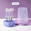 Purple baby silicone toothbrush set with bristles and tongue cleaner displayed on a purple storage case