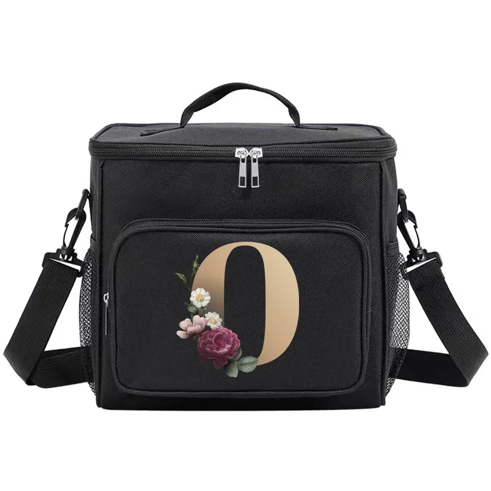 Black insulated canvas lunch bag with a rose design and adjustable strap.