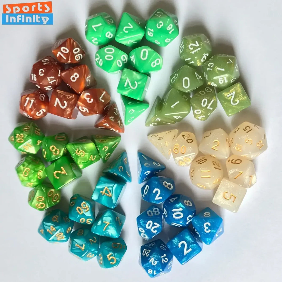 A set of seven polyhedral dice in various shades of green and amber resting on a white surface.