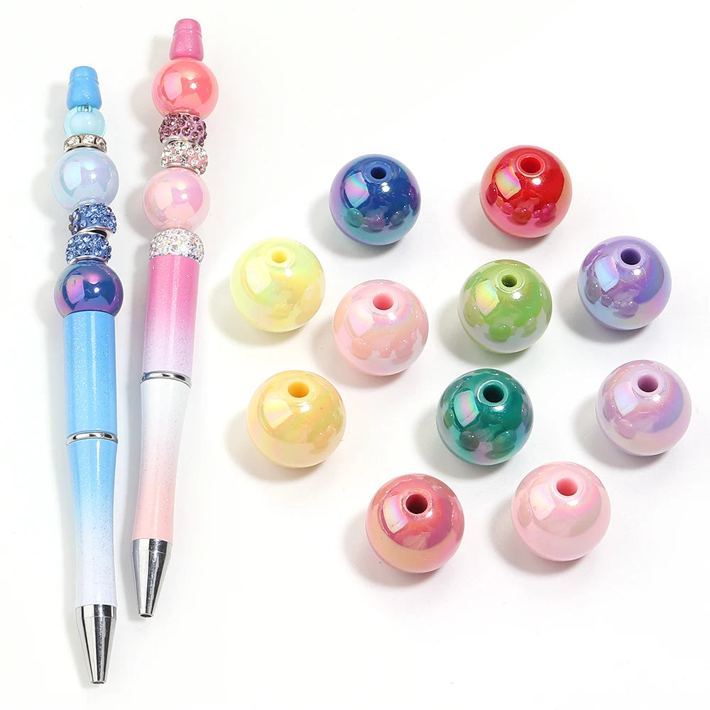 A collection of colorful acrylic round beads in various shades including blue, pink, green, and purple.