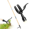 A pair of black weed pullers with long wooden handles shown next to some green plants.