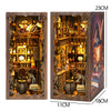 A wooden book nook kit featuring detailed miniature scenes with warm LED lighting.