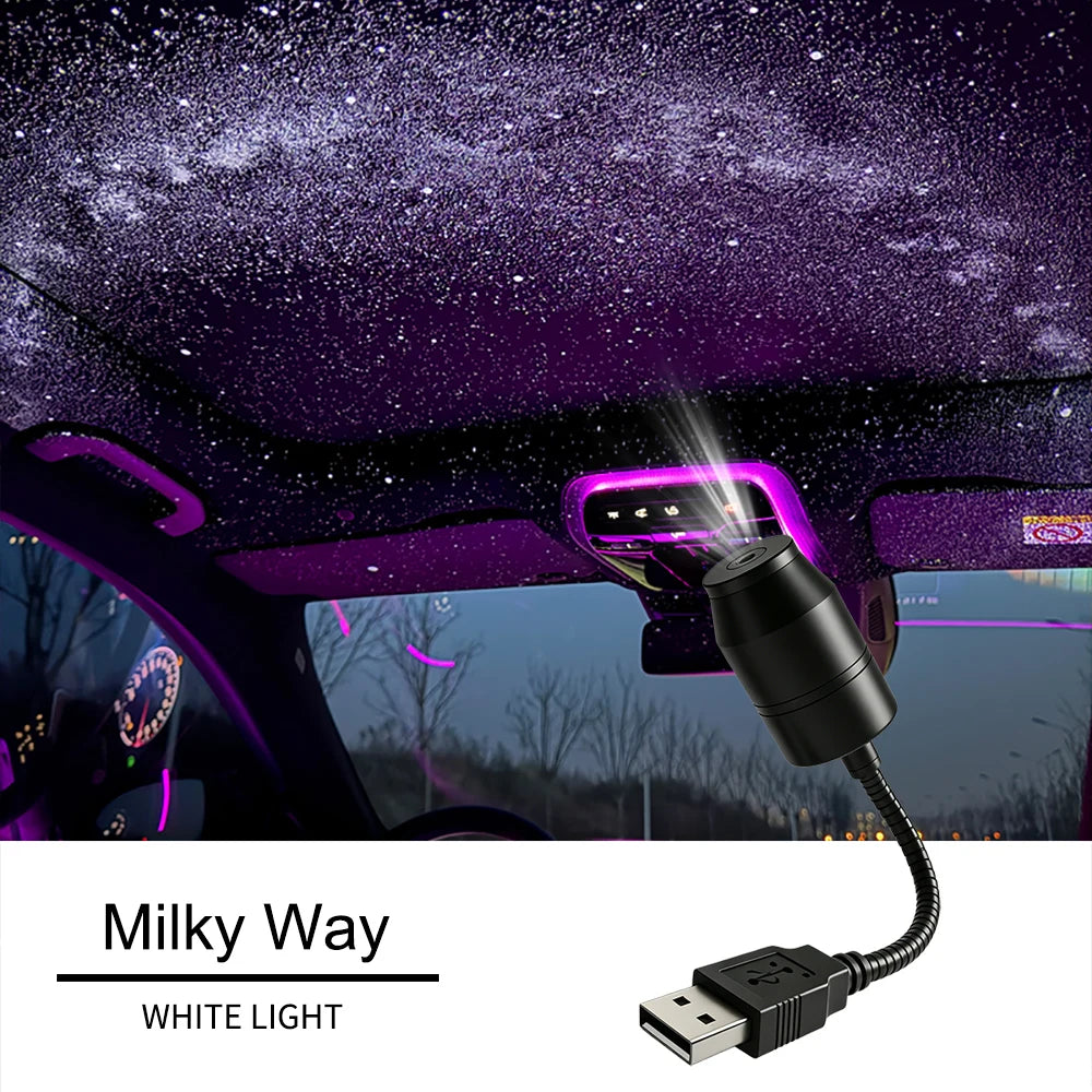A purple starry night effect projected onto a car ceiling by a USB light source.