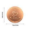 A round, copper purification disk for a bird bath, featuring an engraved bird design and triple-point support.