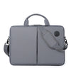 A gray men's business commuter laptop briefcase with a padded shoulder strap and a circular detail.