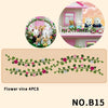 A set of four flower vines featuring pink, white, and green leaves for decoration.