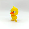 A yellow, stylized duck statue with an angry expression and orange beak.