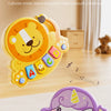 A yellow lion-shaped finger piano toy and a purple cat-shaped finger piano toy for early education.