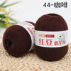 A ball of dark brown yarn labeled 44-ply, used for knitting and crochet projects.