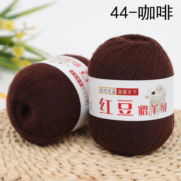 A ball of dark brown yarn labeled 44-ply, used for knitting and crochet projects.