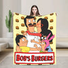 A playful cartoon featuring characters from Bob's Burgers on a yellow blanket.