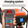A hand holds an ANENG BT-172 test generator charging system device connected to an orange generator.