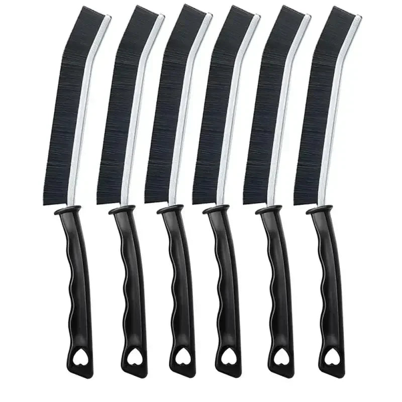 A set of black and white multifunctional crevice cleaning brushes.