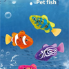 Colorful plastic fish toys swimming in blue water with bubbles and waves.