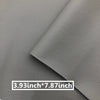 A close-up of a gray leather repair patch, measuring 3.93 inches by 7.87 inches.