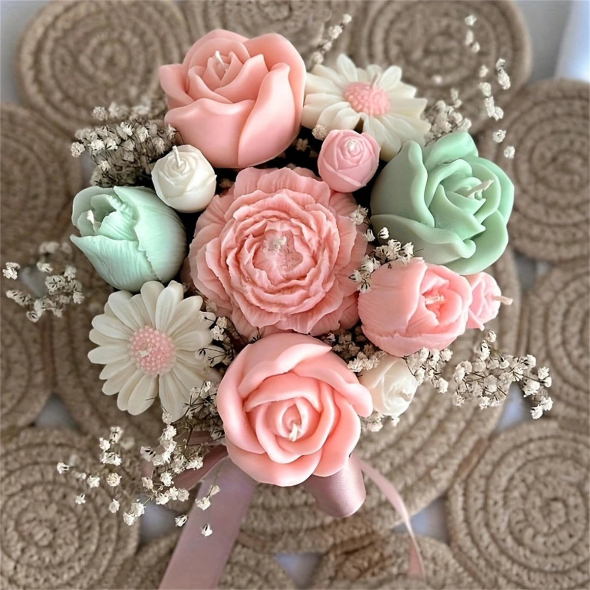 A floral silicone mold set featuring pink and green roses and daisies arranged on a neutral background.