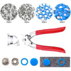 A set of metal snap fasteners and a pair of pliers tool for use in crafting or repair.