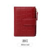 A deep red crocodile-embossed PU leather bifold wallet.