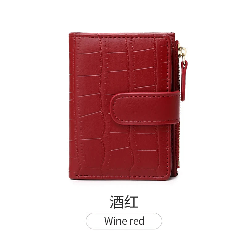 A deep red crocodile-embossed PU leather bifold wallet.