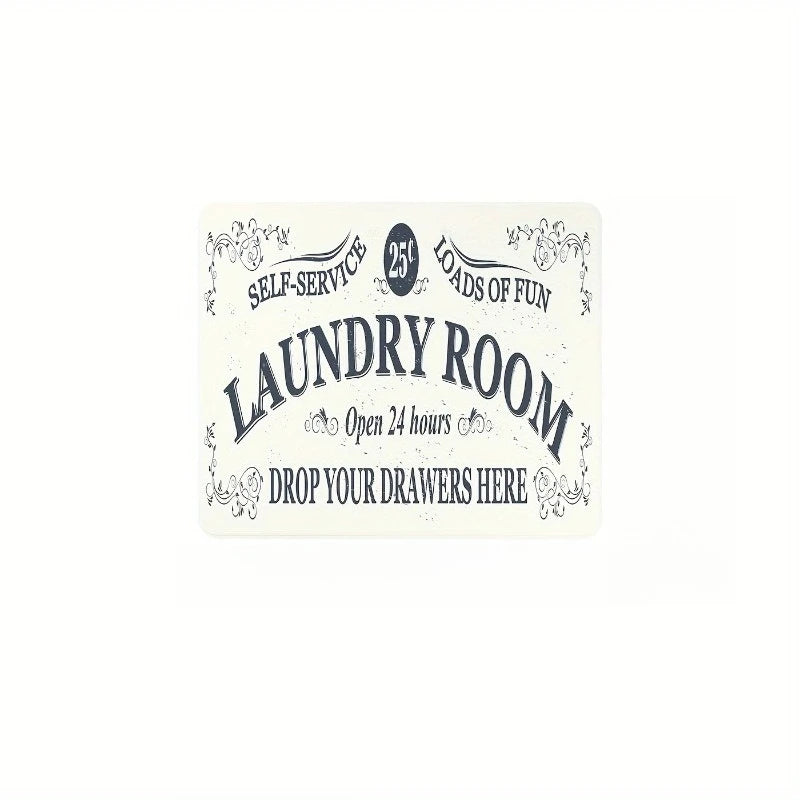 A white sign for a laundry room with text indicating self-service and open hours.