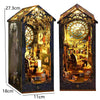 A decorative wooden book nook kit featuring intricate details and internal LED lighting.