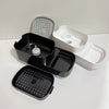 A set of black and white countertop soap dispensers with built-in sponge holders.