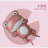 A pink wind-up swimming frog bath toy with large eyes and limbs.