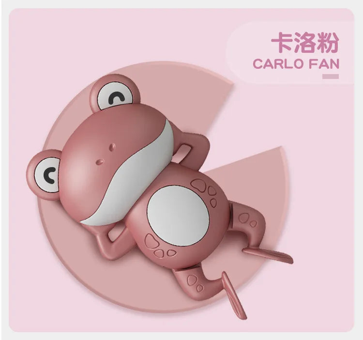 A pink wind-up swimming frog bath toy with large eyes and limbs.