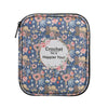 A light green crochet hook organizer bag featuring a floral pattern and a text encouraging happiness.
