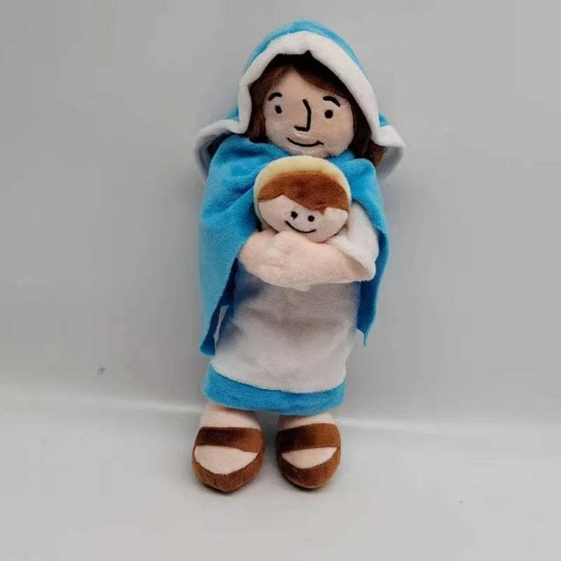 A soft plush doll depicting a mother and child, dressed in blue fabric and white clothing.