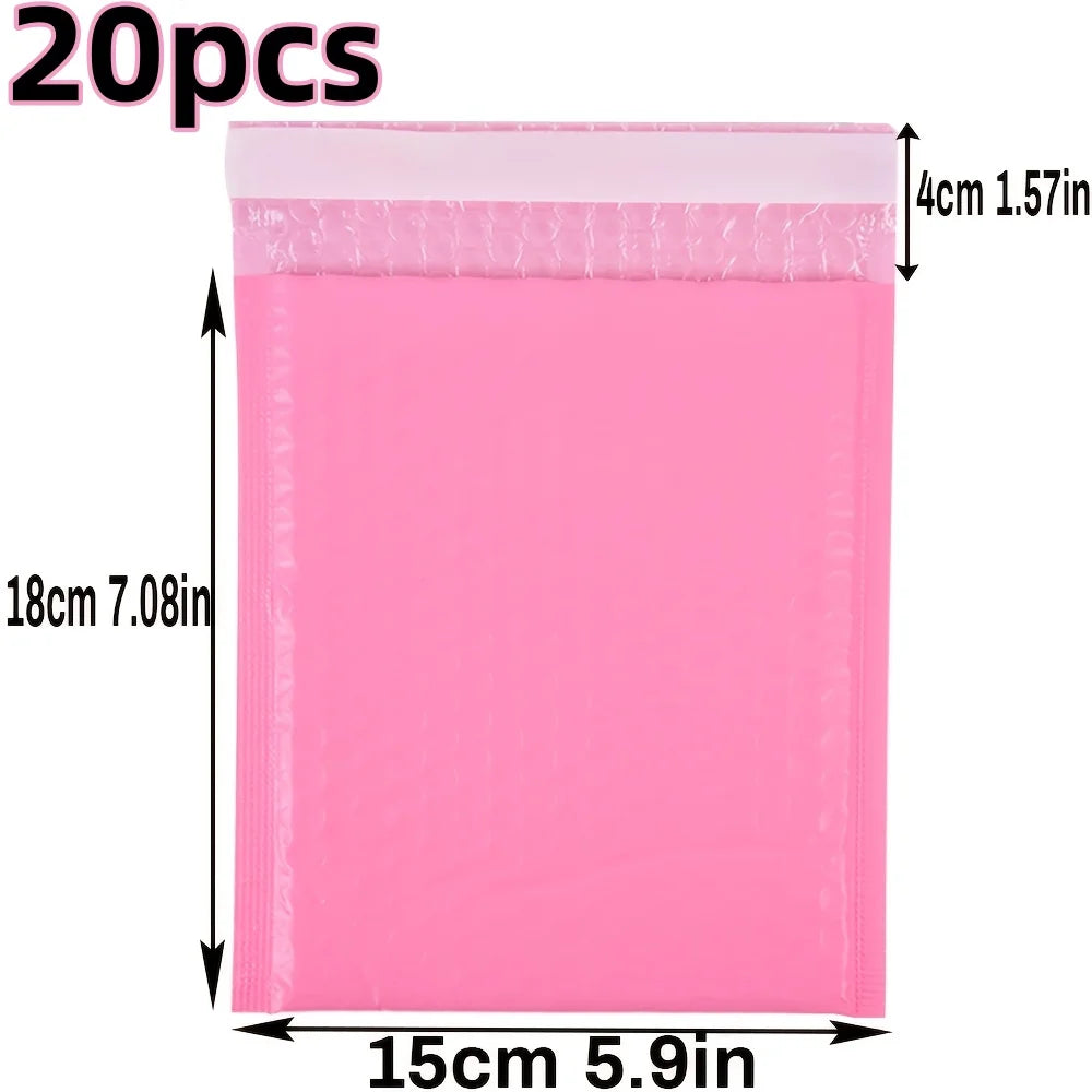 A pink self-seal padded bubble mailer with dimensions of 15cm by 18cm.