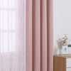 Pink dual layer window curtains featuring sheer and blackout fabric in a soft rose color