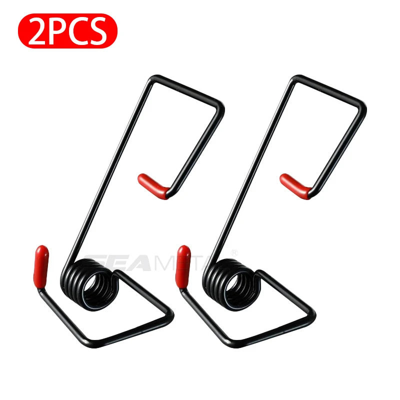 Two black universal wiper booster springs with red tips for improving windshield contact and reducing vibrations