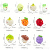 A collection of six hand-painted resin vegetable figurines, including a lemon, a carrot, and various gourds, for fairy garden