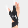 A hand wearing black waterproof LED half-finger gloves with an adjustable strap, demonstrating light beams.