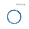A round blue diamond ring featuring a halo of small blue stones.