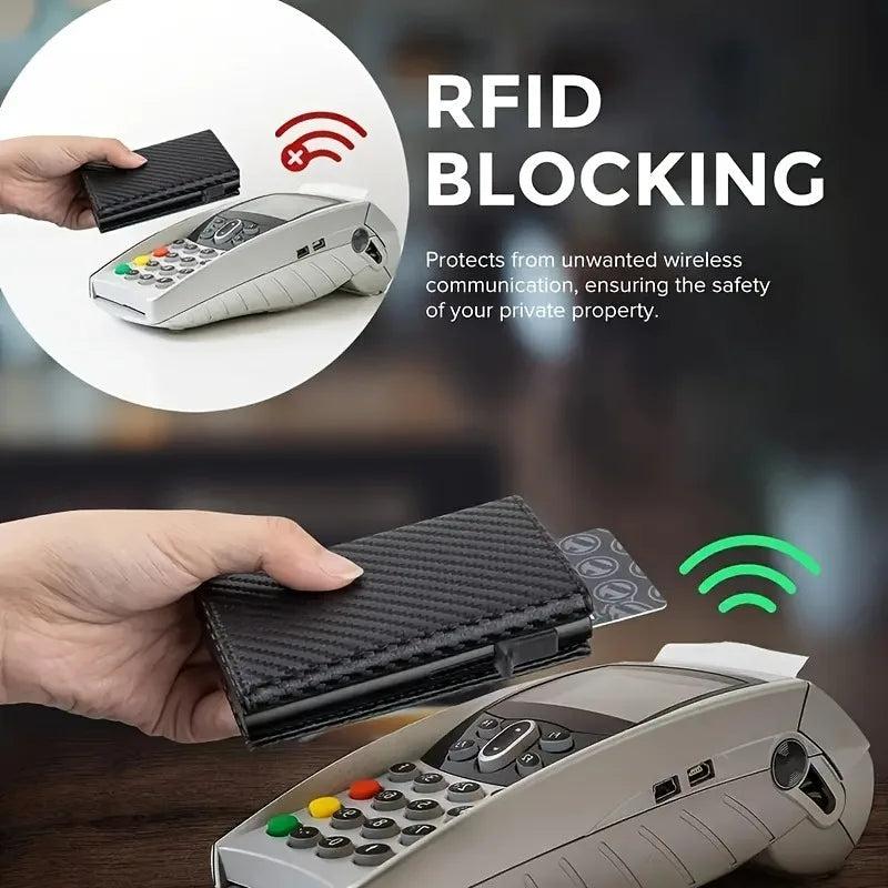 A hand holds a black slim pop-up wallet with RFID blocking technology and an electronic device.