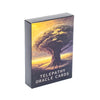 A box of Telepathy Oracle Cards featuring an image of a large tree silhouetted against a sunset background.